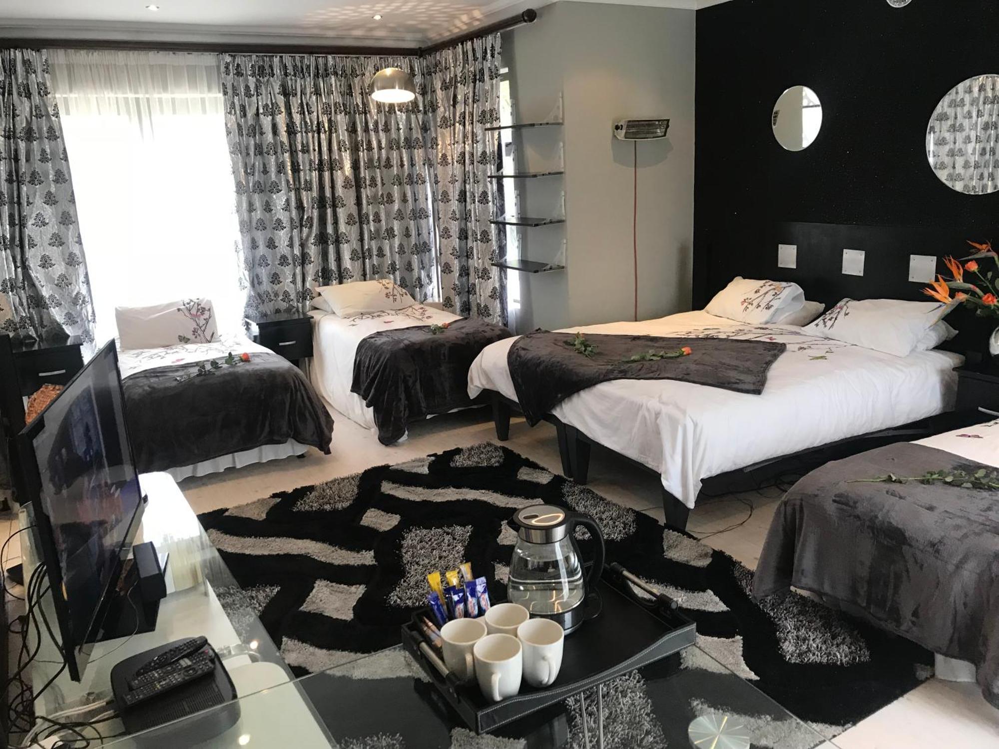 Africa Paradise - Or Tambo Airport Boutique Hotel Бенони Номер фото